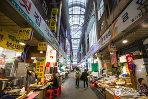 A picture containing text, marketplace, store, area Description automatically generated